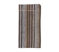 A folded Windsor Napkin from the Kim Seybert Set of 4 – Multi, showcasing vertical stripes in brown, gray, yellow, and burgundy with stitched edges. The versatile neutral palette complements modern napkin rings for a chic and stylish table setting.