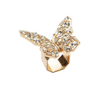 The Kim Seybert Papillon Butterfly Napkin Ring Boxed Set of 4 features gold rings with detailed butterfly designs and faceted clear gemstones—perfect for adding a touch of luxury to your table décor.