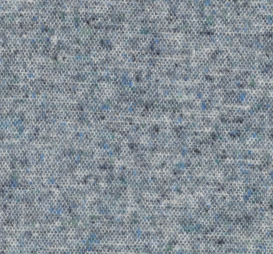 Close-up of the Cinder Mist Throw by Lands Downunder, featuring a textured grey fabric with small blue and black specks throughout; its soft, flecked appearance makes it perfect for a modern Italian throw blanket, crafted from high-quality woven textile material.