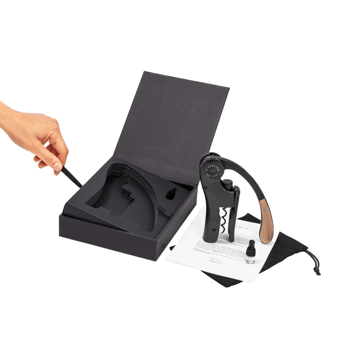 L’ Atelier du Vin Lever Wine Opener - Black with a wooden handle, displayed with its storage box, a small vial, and an instructional pamphlet in this luxury wine gift set.