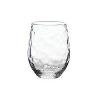 The Juliska Puro Glassware tumbler features a rounded shape and textured, dimpled surface. Shown empty against a white background, it is dishwasher safe for easy cleaning.