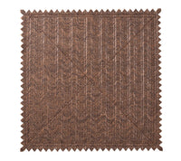 The Vista Reversible Placemat s/4 - Natural & Brown by Kim Seybert features a brown rectangular woven fabric with a chevron pattern and zigzag-cut edges, resembling a basketweave or faux raffia placemat.