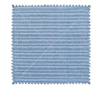 The Kim Seybert Vista Reversible Placemat set of 4 in Navy & Periwinkle features a rectangular, textured blue faux raffia design with horizontal ridges and zigzag-cut edges, shown on a white background.