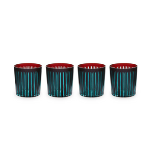 The Prism DOF Set of 4 by L'Objet features hand-cut glass tumblers with vertical turquoise stripes and a vivid red interior, beautifully arranged on a white background—ideal for fans of bold, colorful designs.