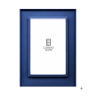 The Prisma Frame - Admiral by Bella Moulding is a rectangular blue acrylic frame with a white center displaying the Current Home logo and gray CH initials, featuring an arrow pointing down in the bottom right corner.