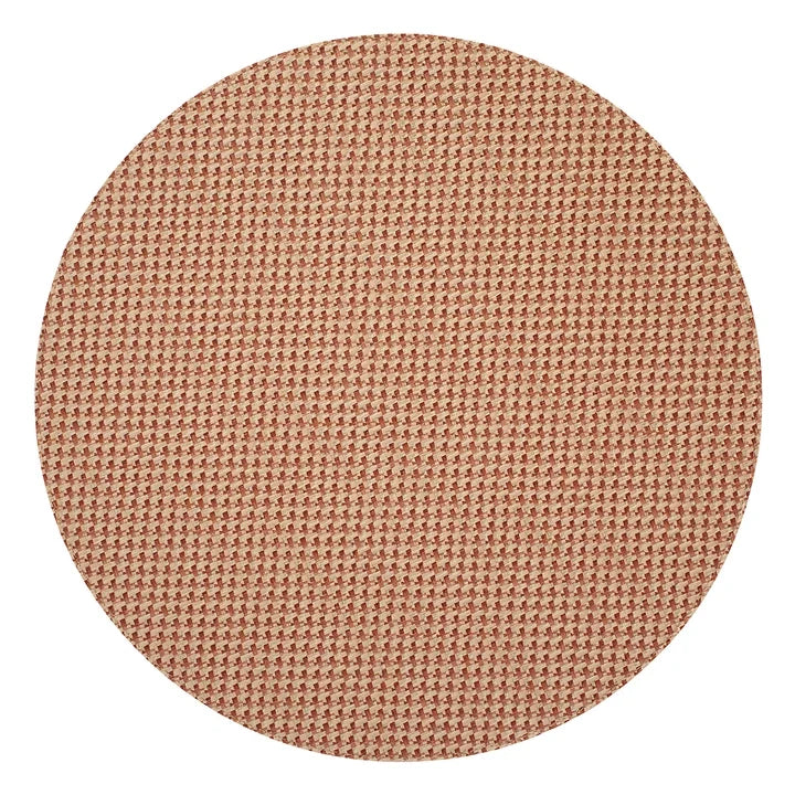 Round Bodrum Rattan Round Placemat - Terracotta with a terracotta-colored vinyl finish and a rattan texture.