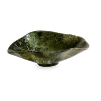 A striking table accent, the Resin Malachite Oval Bowl Green by Beatriz Ball features an irregular, organic silhouette and a glossy, mottled surface reminiscent of malachite. Set against a plain white background, its one-of-a-kind design draws the eye and adds elegance to any setting—perfect for serving salads or as a unique decorative piece.