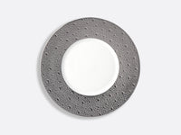 Featuring a round plate from Bernardaud’s Ecume Platinum Dinnerware collection, this piece showcases a textured, dark gray rim and a smooth white center—presented on a light gray background—to bring contemporary flair and timeless elegance to your table setting.