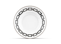 A round white Catene Nero dinner plate by Ginori 1735, featuring a black geometric chain pattern around the rim, displayed against a plain white background.