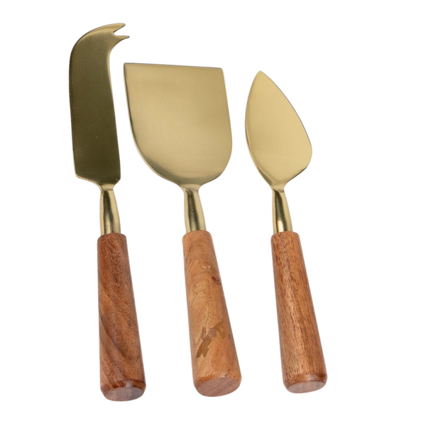 The Go Home Dauphine Cheese Knives s/3 set features gold-toned stainless steel blades and wood handles, including a fork-tipped knife, flat rectangular knife, and pointed wedge—ideal for any cheese board.