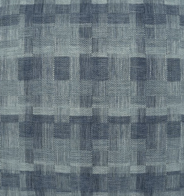 A close-up of D.V. KAP / Canaan Company’s Inlay Pillow Denim shows blue textured fabric with a woven geometric checkerboard design in varied shades of blue.