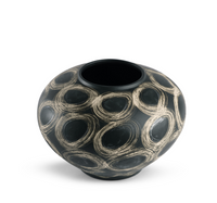 The Wren Vase - Black by FlowDecor Inc. is a round, black ceramic vase with a wide silhouette, narrow opening, and beige hand-drawn swirls covering its surface.