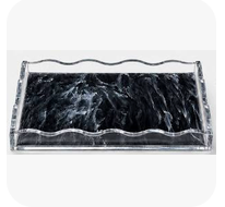 Tizo Wave Marbelized Rectangle Tray Black - Small 8 x 12 featuring a black and white marbled base and clear, wavy-edged sides.