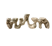 A sculptural, multi-branched Forma Menorah - Marble candle holder with contemporary elegance, crafted from white, gray, and black marbled material.