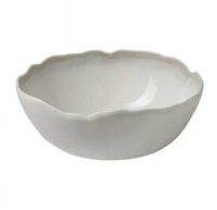 The Plume White Dinnerware Pearl bowl by Jars - Rosenthal features a smooth, glossy finish and uneven, wavy edges, displayed against a plain background.