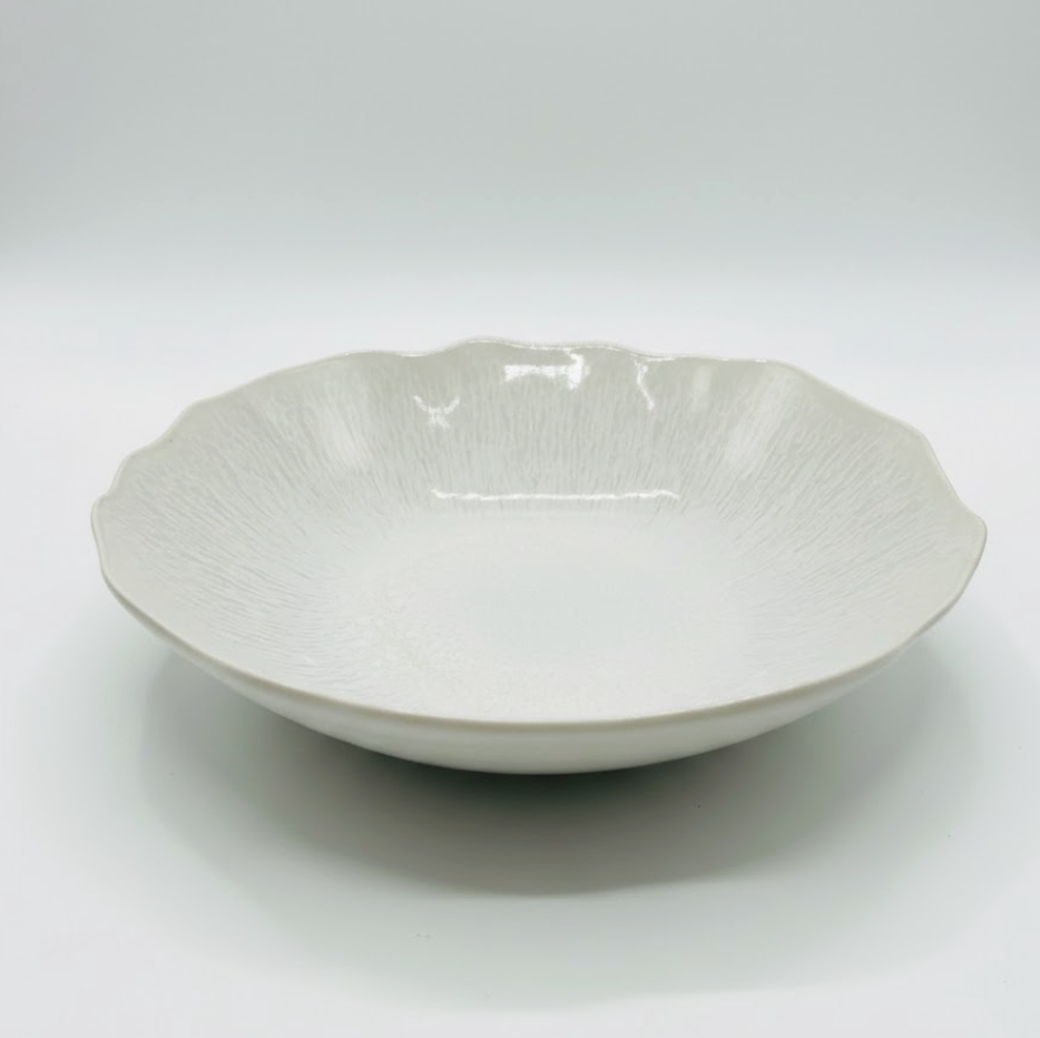 The Plume White Dinnerware Pearl by Jars - Rosenthal, shown against a white background, features a scalloped edge, subtle textured pattern, and shallow wide shape inspired by elegant ceramic design.