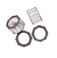 Set of four Arthur Napkin Rings in dark grey by Blue Pheasant, featuring clear octagonal crystals with dark edges, two upright and two flat on a white background.