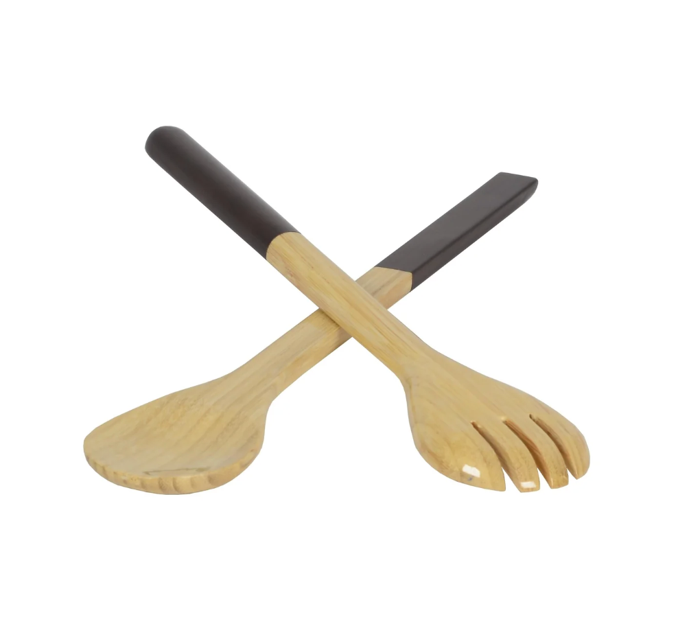 Two Albert L Bamboo Classic Salad Servers—one slotted spoon and one flat spatula with dark handles—are crossed on a white background, highlighting this eco-friendly kitchen utensil set.