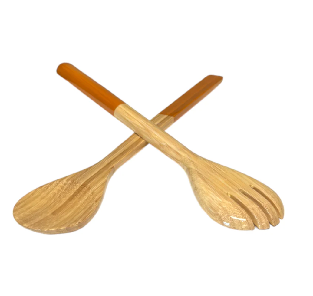 The Albert L Bamboo Classic Salad Servers Set Long features a spoon and slotted fork crossed on a white background—an ideal eco-friendly addition to your kitchen.