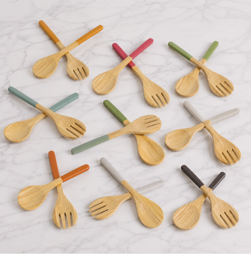 Ten pairs of Albert L Bamboo Classic Salad Servers Set Long, featuring eco-friendly servers with colorful handles (orange, green, gray, red, brown, teal), are arranged in rows; each set includes a large bamboo spoon and fork.