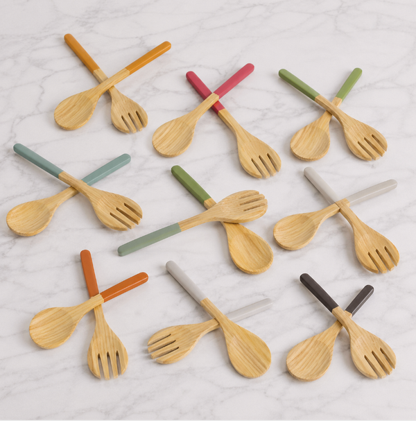 Ten pairs of Albert L Bamboo Classic Salad Servers Set Long, featuring eco-friendly servers with colorful handles (orange, green, gray, red, brown, teal), are arranged in rows; each set includes a large bamboo spoon and fork.