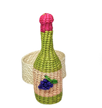 The Coro Cora Wine Napkin Ring Set of 4 - Pink features artisanal, bottle-shaped woven rings with pink tops and grape decorations, showcasing handcrafted Colombian design and adding vibrant table decor.