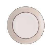 A round ceramic plate from Marie Daâge Ruban 1 Dinnerware features a light pinkish-white center and a textured gradient rim in soft gray and reddish-brown tones. The plate, viewed from above on a white background, is by Marie Daâge.