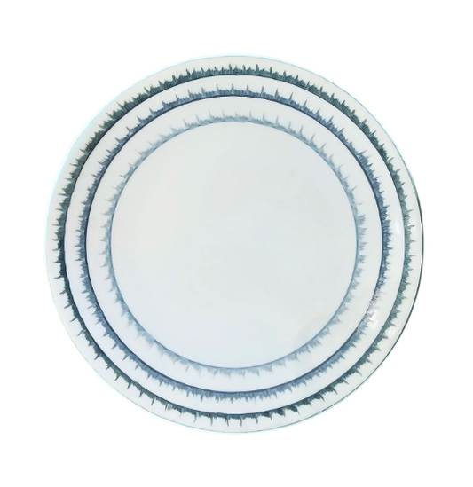 A stack of three Marie Daâge Sisal 1 Platinum Rim Dinnerware plates by Marie Daâge, featuring white ceramic with platinum-accented rims and intricate geometric patterns inspired by luxury French design, viewed from above on a white background.