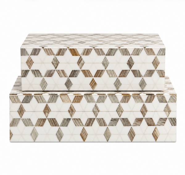 Two rectangular boxes from Bojay, named the Starlink Etched Box, feature a repeating geometric pattern of hexagons and cubes in shades of white, beige, and brown. Crafted with exquisite bone inlay, each box is ideal for use as a jewelry box or decorative accent. The smaller box is displayed on top of the larger one.