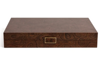 The Malaga Backgammon Set 19″ by Zodax is a rectangular, dark brown wooden box featuring a distinct wood grain pattern and a small, gold-colored rectangular handle on the front, combining elegance and sophistication for discerning players.