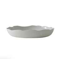 The Plume White Dinnerware Pearl by Jars - Rosenthal is a shallow, white ceramic bowl featuring a wavy, scalloped rim reminiscent of organic forms, presented against a plain white background.