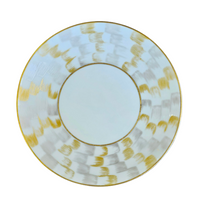 The Marie Daâge Zephyr 1 Dinnerware by Marie Daâge is a round white porcelain plate with a wide rim adorned with a hand-painted gold and silver checkered pattern, photographed on a white background.