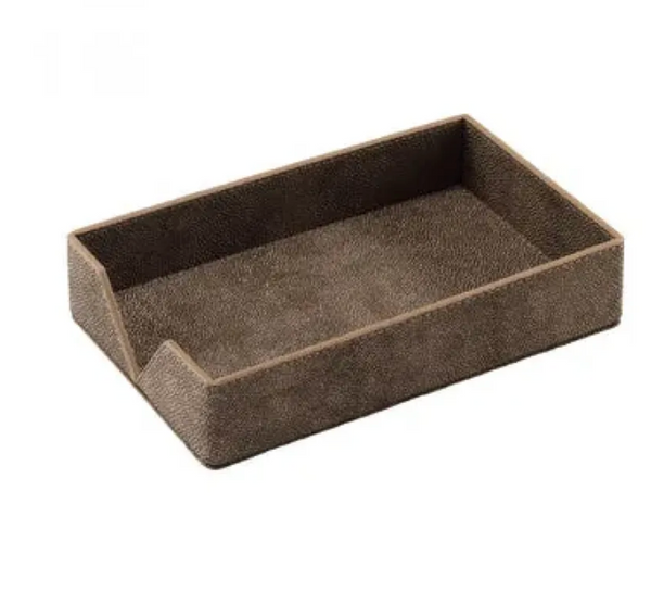 Introducing the Bodrum Stingray Guest Towel Holder—a rectangular brown tray with a textured surface and a distinctively lowered front corner, perfect for holding note cards, papers, or guest napkins. Crafted from phthalate-free vinyl, this elegant holder offers both style and safety and can also be used as a chic guest towel box.