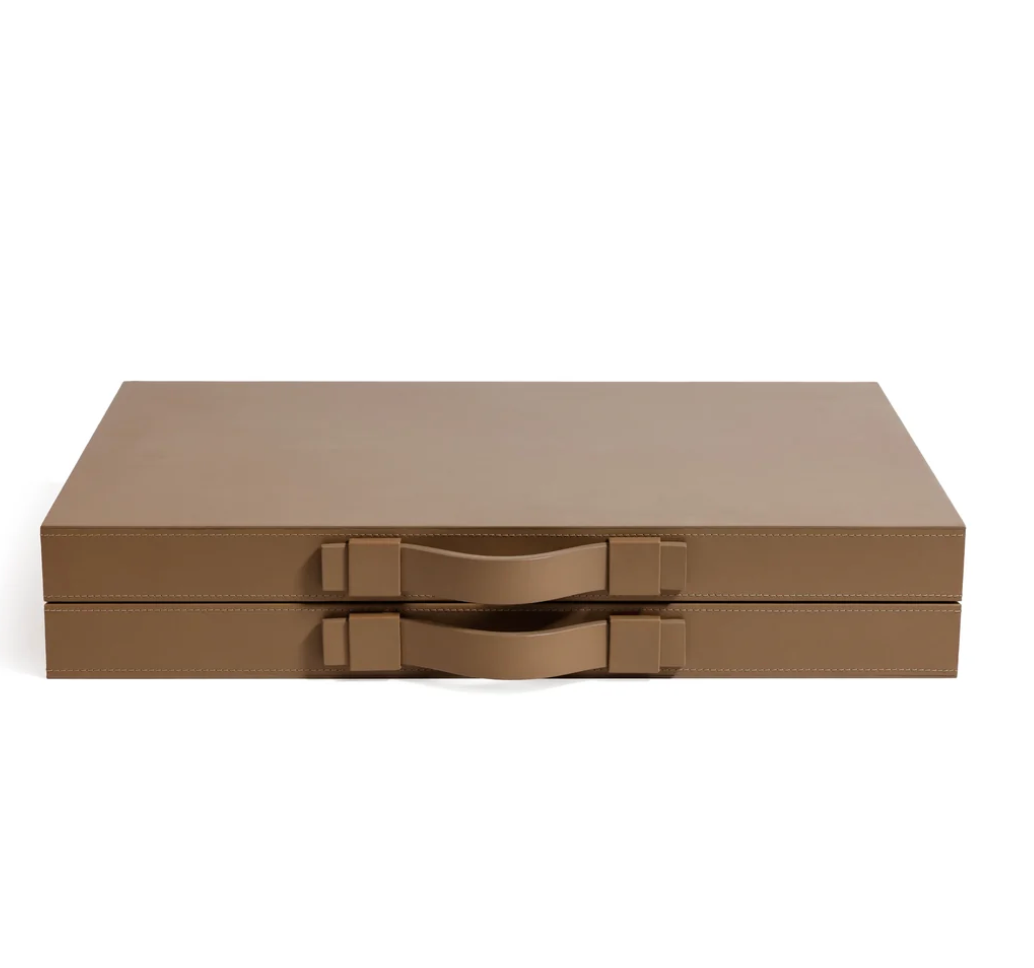Two stacked, rectangular Gene Leather Backgammon cases in taupe from Zodax, each featuring matching handles, are displayed against a plain white background, evoking the refined elegance of a luxury game board or handcrafted backgammon set.