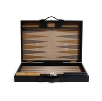 The Gene Leather Backgammon - Midnight Black by Zodax is a luxury open set featuring a sleek board, dice, doubling cube, and pieces—all beautifully arranged inside.