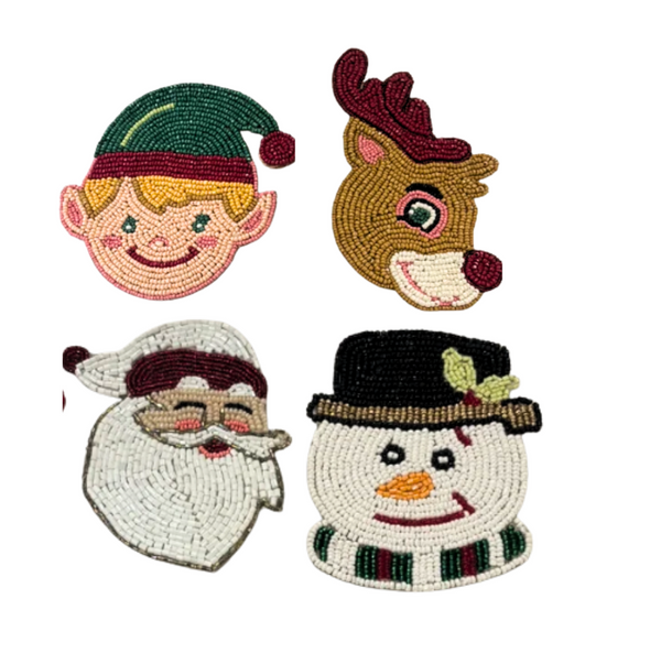 Bodrum Yuletide Tales Coaster Set of 4 featuring the faces of an elf, a reindeer, Santa Claus, and a snowman.