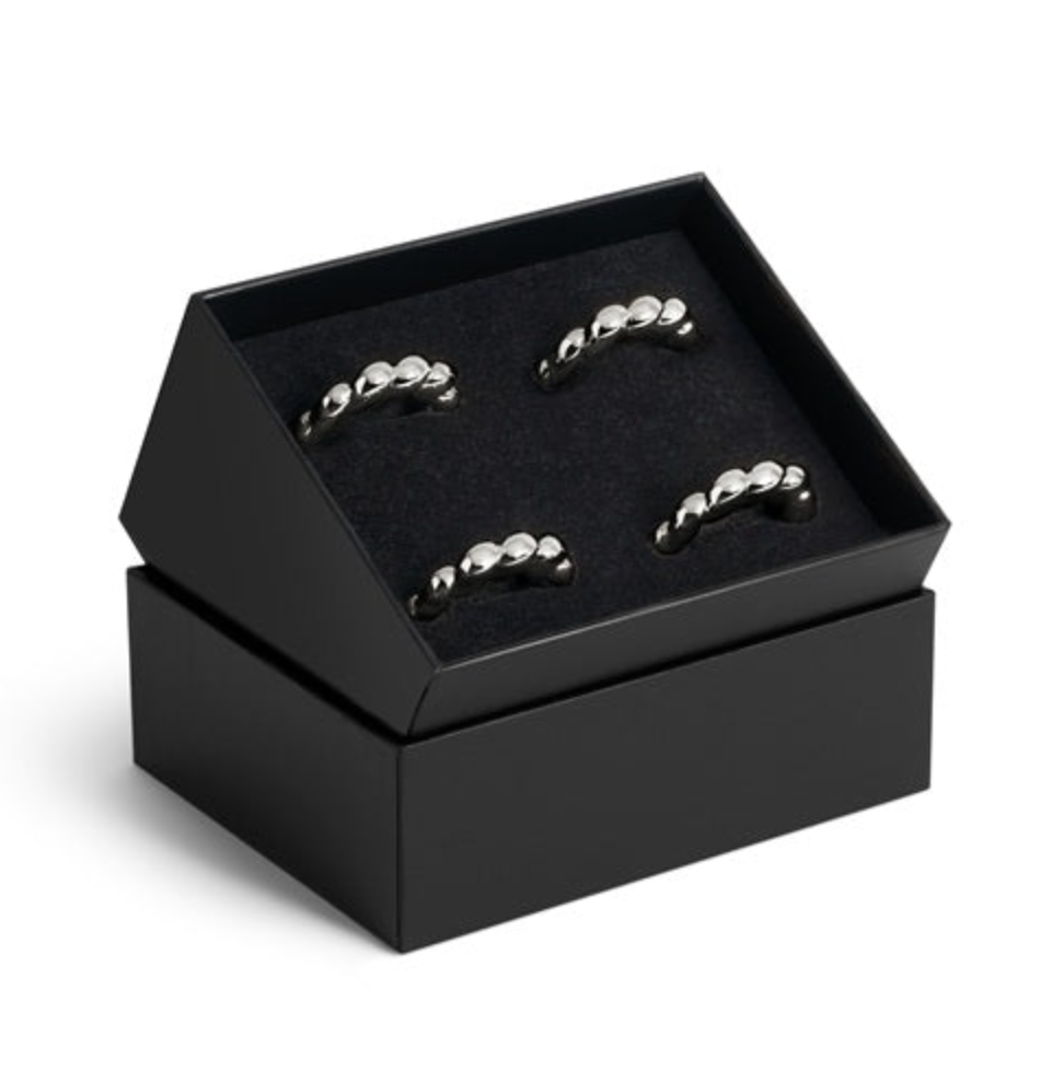 Set of four silver-toned, shell-inspired Jessica McCormack Shell Napkin Ring Set of4 - Platinum napkin rings presented in a luxury gift box.