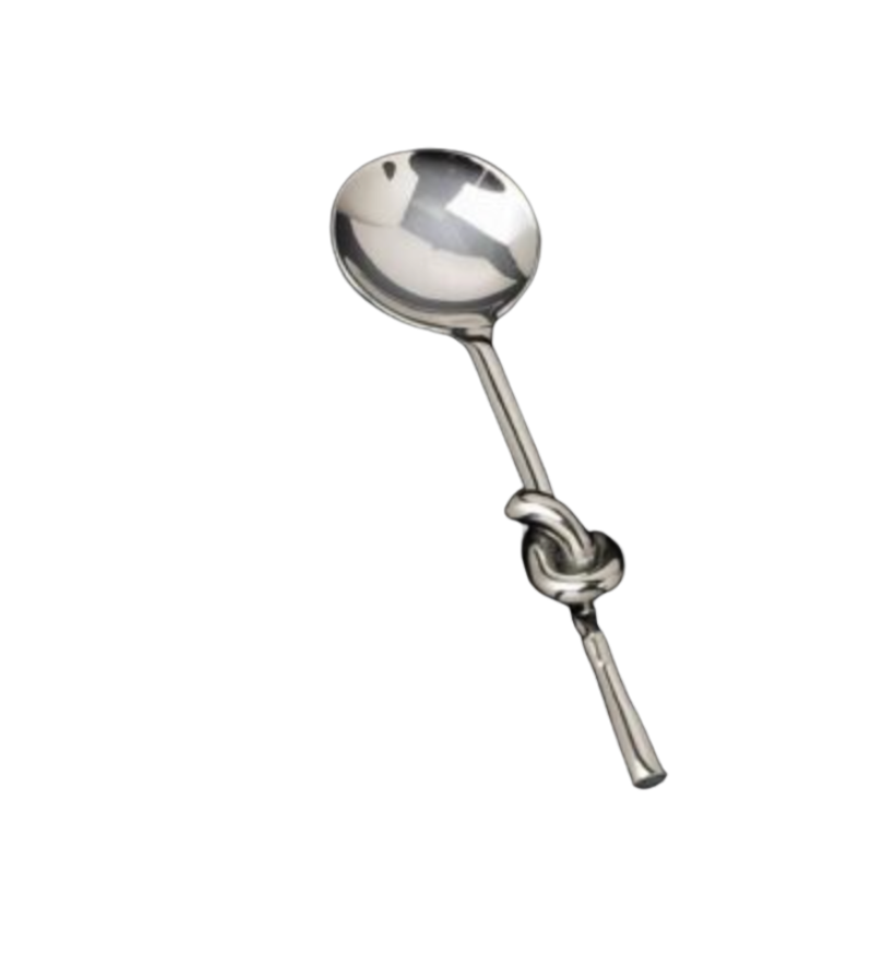 A handcrafted metallic Knotty Spoon by Inspired Generations with a handle tied into a decorative knot.