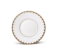 L’Objet Aegean Filet Gold Dinnerware plate in fine porcelain, featuring a scalloped rim and a thin gold circular detail in the center.