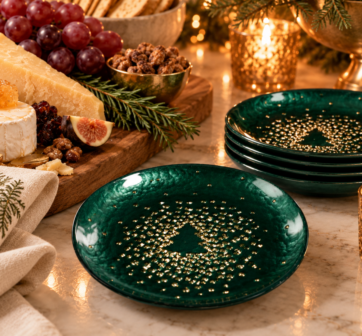 Glistening Tree Plate Set of 4 - Gold & Green arranged on a table with a charcuterie board and holiday decor.
