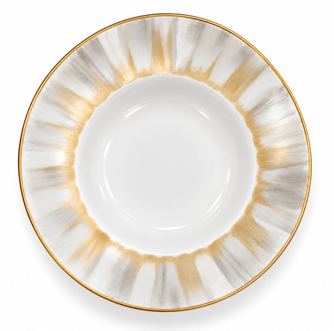 Marie Daâge Panache white Limoges porcelain soup bowl featuring a wide rim with a radiating pattern of hand-painted gold and grey brushstrokes and a gold-trimmed edge.