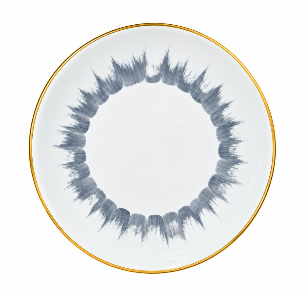 Marie Daâge Iris 1 dinner plate in white Limoges porcelain with a gold rim and a circular, grey, hand-painted brushstroke pattern.