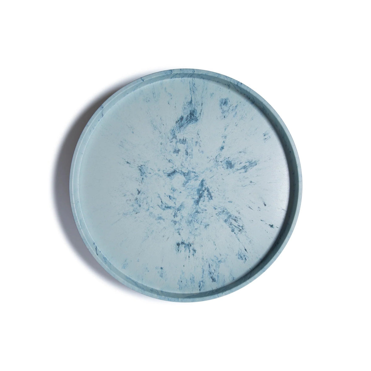 The Trashy Goods Smart Lazy Susan is a round tray with a light blue background and darker blue marbled patterns, perfect as a sustainable organizer or upcycled serving tray, shown from above on a white surface.