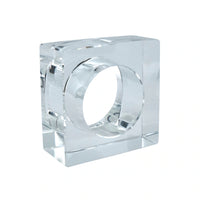 Elevate your dining decor with the Tizo Crystal Cube Napkin Ring Set of 4 – Clear. Featuring square-shaped, clear crystal napkin rings with a circular center, these modern accents add a touch of elegance to any table setting. Photographed on a white background for a sophisticated look.