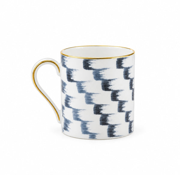 Marie Daâge Iris 1 Dinnerware mug in white Limoges porcelain, featuring a blue brushstroke pattern with a gold rim and handle.