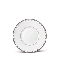 L’Objet Aegean Filet Platinum dinner plate in white porcelain with a scalloped edge outlined in metallic platinum accents.