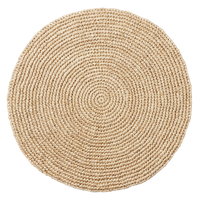 Emmy Round Placemat S/4 - Natural, a round placemat made of coiled, woven natural fiber.