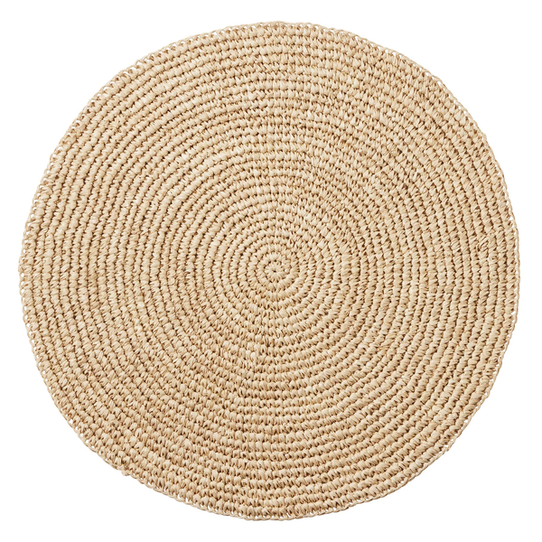 Emmy Round Placemat S/4 - Natural, a round placemat made of coiled, woven natural fiber.