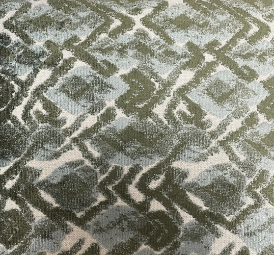 The Landmark Pillow Spruce by Decor Fifty-Five features a green and white geometric diamond pattern with textured fabric and overlapping shapes, creating a fresh, modern accent for your space.
