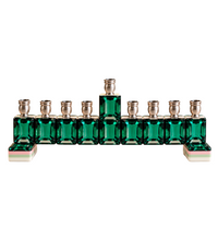 The Mah Jong Menorah - Green Emerald features nine candle holders shaped like rectangular game tiles, supported by two layered, multi-colored bases.